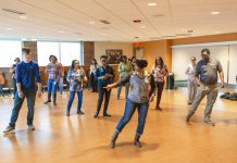 Hustle Dance Class in the Kellogg Room. Participants learning to dance.