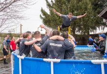KCC Police Academy cadets cheer on a fellow student as he jumps during the polar plunge event in 2017.