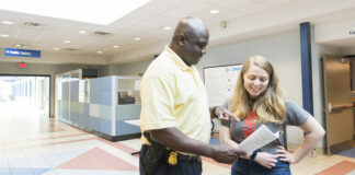 KCC campus security conversing with a student