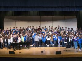 High school choir members rehearse for the annual Prado concert in 2018