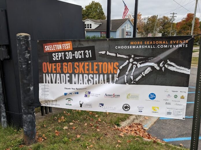 A sign depicting the information about marshall's skeleton fest